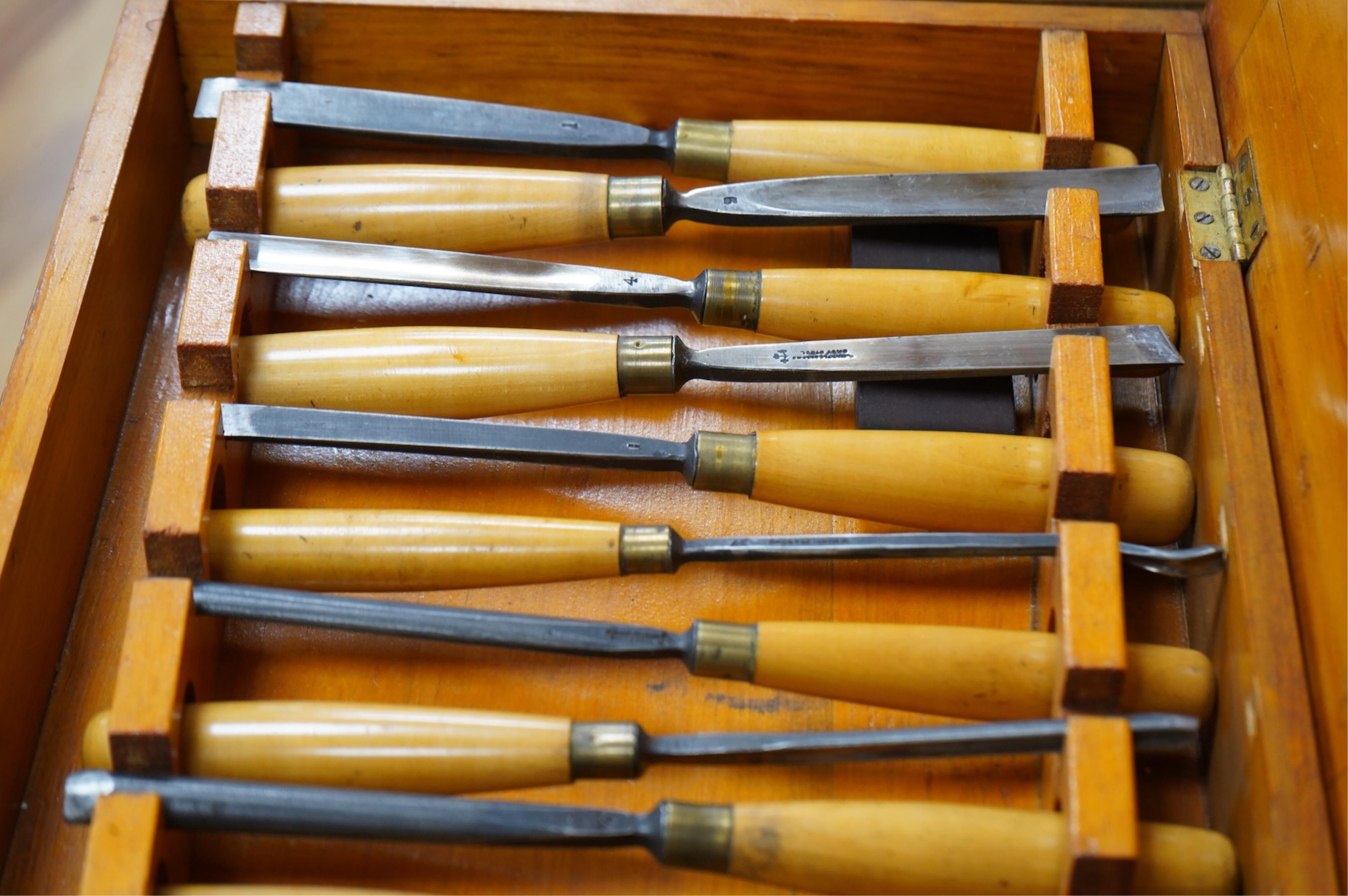 An 18-piece Marples wood carving chisel set, contained within the original fitted pine case with original Marples label to the inside of the lid